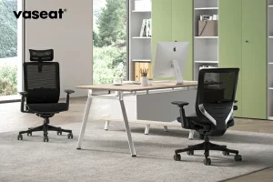 One SM6 with headrest black and one SM6 ergonomic chair without headrest black at a desk