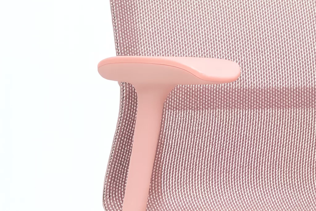 close-up of pink ergonomic office chair with mesh back
